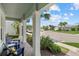 Relaxing front porch showcasing comfortable seating, lush landscaping, and a view of the serene neighborhood at 12130 Seabrook Ave, Bradenton, FL 34211