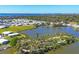 Expansive aerial view featuring a stunning lake community with palm-lined paths and beautiful water views at 1224 41St Avenue E Dr, Ellenton, FL 34222
