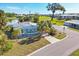 Aerial view showcasing the home's location, landscaping, and neighborhood, highlighting its desirable features at 1224 41St Avenue E Dr, Ellenton, FL 34222