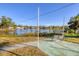 Backyard with a lake view, featuring lush greenery and a bench, perfect for outdoor relaxation and enjoyment at 1224 41St Avenue E Dr, Ellenton, FL 34222