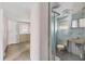 Combination of bedroom and bathroom area featuring simple design and natural light, connected for convenience at 1224 41St Avenue E Dr, Ellenton, FL 34222