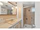Bathroom with updated shower, vanity, and bright lighting at 1224 41St Avenue E Dr, Ellenton, FL 34222