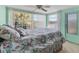 Bedroom featuring a large window overlooking the water and a ceiling fan at 1224 41St Avenue E Dr, Ellenton, FL 34222