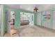 Spacious bedroom with bright walls, neutral carpet, and a view of the water at 1224 41St Avenue E Dr, Ellenton, FL 34222
