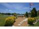 Scenic community park overlooking a lake with benches, walkways, and memorial flag pole, offering a tranquil outdoor space at 1224 41St Avenue E Dr, Ellenton, FL 34222