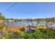 Scenic dock with lake view, providing a serene spot for relaxation and outdoor enjoyment at 1224 41St Avenue E Dr, Ellenton, FL 34222