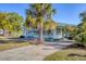 Charming single Gathering home featuring mature landscaping and a cozy, screened in porch at 1224 41St Avenue E Dr, Ellenton, FL 34222