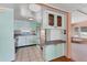 The kitchen features retro cabinets and tile flooring at 1224 41St Avenue E Dr, Ellenton, FL 34222