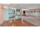 Open-concept living area with hardwood floors that connect the kitchen and living room at 1224 41St Avenue E Dr, Ellenton, FL 34222