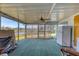 Enclosed sunroom with scenic lake views, offering a relaxing space with ample natural light and outdoor access at 1224 41St Avenue E Dr, Ellenton, FL 34222