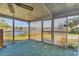 Screened-in porch boasting views of the surrounding landscape, seamlessly blending indoor and outdoor living at 1224 41St Avenue E Dr, Ellenton, FL 34222