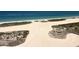 Expansive beach with a sandy landscape surrounded by lush greenery and clear ocean waters at 1270 Gulf Blvd # 1503, Clearwater Beach, FL 33767