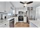 Bright kitchen with stainless steel appliances, ample counter space, and stylish cabinetry at 1270 Gulf Blvd # 1503, Clearwater Beach, FL 33767