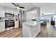 Modern kitchen features stainless appliances, white cabinets, and an island with breakfast bar seating at 1270 Gulf Blvd # 1503, Clearwater Beach, FL 33767