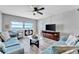 Inviting living area showcasing a large window with an ocean view and stylish furnishings at 1270 Gulf Blvd # 1503, Clearwater Beach, FL 33767