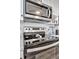 Modern stainless-steel stove, microwave, and cabinetry are a highlight of this space at 1270 Gulf Blvd # 1503, Clearwater Beach, FL 33767