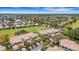 Scenic aerial view showcasing community residences adjacent to lush green fairways at 1311 Triano Cir # 1311, Venice, FL 34292