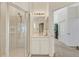 Bright bathroom features a glass-enclosed shower and a white vanity at 1311 Triano Cir # 1311, Venice, FL 34292