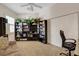 Bedroom featuring a sofa, bookshelf, and a comfortable workspace at 1311 Triano Cir # 1311, Venice, FL 34292