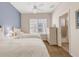 Bedroom featuring twin beds with white linens, neutral carpet, and ensuite bathroom at 1311 Triano Cir # 1311, Venice, FL 34292