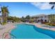 A view of the community pool with plenty of space for chaise lounges at 1311 Triano Cir # 1311, Venice, FL 34292