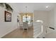 Dining room with stairway, glass brick decor, and modern chandelier at 1311 Triano Cir # 1311, Venice, FL 34292