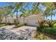 Charming townhome with well-maintained landscaping, paver driveway, and attached two-car garage at 1311 Triano Cir # 1311, Venice, FL 34292