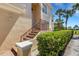 Attractive front entrance to home with brick steps, decorative railings, and lush landscaping at 1311 Triano Cir # 1311, Venice, FL 34292