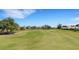 Scenic golf course view with mature trees and lush green fairway at 1311 Triano Cir # 1311, Venice, FL 34292