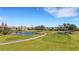 Picturesque golf course with serene water features, lush greenery, and community at 1311 Triano Cir # 1311, Venice, FL 34292