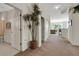 Hallway with plant decor and connecting doorways at 1311 Triano Cir # 1311, Venice, FL 34292
