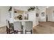Modern kitchen with a breakfast bar and stainless steel appliances at 1311 Triano Cir # 1311, Venice, FL 34292