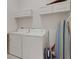 Laundry room with washer, dryer and storage cabinets at 1311 Triano Cir # 1311, Venice, FL 34292