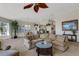 Inviting living room with neutral tones, ample seating, and views into adjacent rooms at 1311 Triano Cir # 1311, Venice, FL 34292