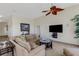 Cozy living area with a comfortable couch and a large TV at 1311 Triano Cir # 1311, Venice, FL 34292