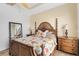 Bright main bedroom with a ceiling fan, and shuttered windows that let in plenty of natural light at 1311 Triano Cir # 1311, Venice, FL 34292