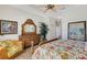 Bright main bedroom with a ceiling fan, and shuttered windows that let in plenty of natural light at 1311 Triano Cir # 1311, Venice, FL 34292