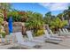 View of the pool area with water features and chaise lounges at 1311 Triano Cir # 1311, Venice, FL 34292