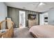 Neutral bedroom featuring a crib, TV, and access to the en-suite bathroom and closet at 14616 20Th E St, Parrish, FL 34219