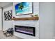 Modern fireplace and mantelpiece with a TV on the wall at 14616 20Th E St, Parrish, FL 34219