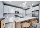 Bright kitchen featuring a spacious island with bar seating, modern appliances, and plenty of cabinet space at 14616 20Th E St, Parrish, FL 34219