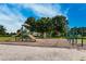 Playground with slides, climbing bars, and swings, surrounded by lush greenery at 14616 20Th E St, Parrish, FL 34219