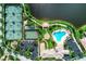 Overhead view featuring tennis, basketball, pool, clubhouse, and lakeside gazebo at 1649 Burgos Dr, Sarasota, FL 34238