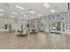 Spacious, light-filled meeting room with plenty of tables and seating plus large windows and an exit to the exterior at 1649 Burgos Dr, Sarasota, FL 34238
