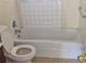 Standard bathroom featuring a toilet, and a classic tiled shower-tub combo at 1778 23Rd St, Sarasota, FL 34234