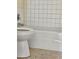 Close up of classic bathroom featuring a toilet, tiled shower-tub combo at 1778 23Rd St, Sarasota, FL 34234
