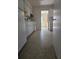 View of the traditional-style kitchen with white appliances and speckled floor at 1778 23Rd St, Sarasota, FL 34234