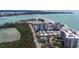 Aerial view of a beachfront high-rise condo with water views at 2050 Benjamin Franklin Dr # A1001, Sarasota, FL 34236