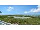 Stunning aerial view of the bay showcasing lush vegetation and blue skies at 2050 Benjamin Franklin Dr # A1001, Sarasota, FL 34236