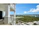 Beautiful balcony offering breathtaking views of the water, lush greenery, and cityscape at 2050 Benjamin Franklin Dr # A1001, Sarasota, FL 34236
